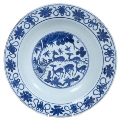 Lot 170 - Chinese blue and white dish, 17th century, boldly painted with five deer in a landscape, the rim with auspicious symbols and flowers, the reverse with pomegranates and flowers, seal mark to base, 3...