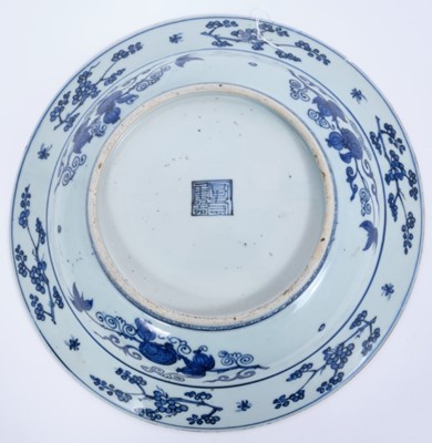 Lot 170 - Chinese blue and white dish, 17th century, boldly painted with five deer in a landscape, the rim with auspicious symbols and flowers, the reverse with pomegranates and flowers, seal mark to base, 3...