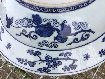 Lot 289 - Chinese blue and white dish, 17th century, boldly painted with five deer in a landscape, the rim with auspicious symbols and flowers, the reverse with pomegranates and flowers, seal mark to base, 3...