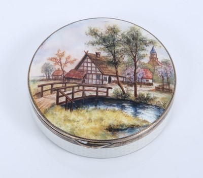 Lot 443 - Silver and enamel circular box with rural landscape decoration