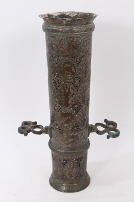 Lot 885 - Persian pierced brass torch stand, Qajar period