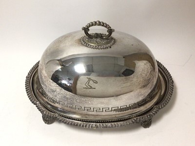 Lot 232 - 19th century silver plated meat cover / serving dome with engraved band of Greek key decoration and engraved armorial, beaded border and beaded scroll handle together with an associated stand with