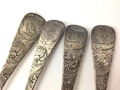 Lot 451 - Four Georgian silver berry spoons