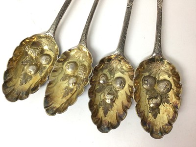 Lot 451 - Four Georgian silver berry spoons