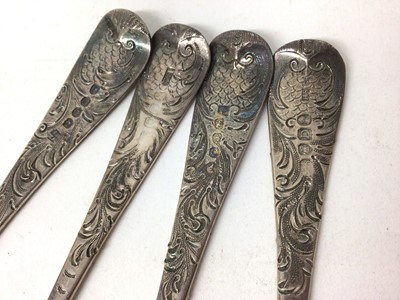 Lot 451 - Four Georgian silver berry spoons