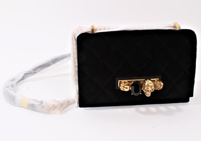 Lot 2130 - Designer Alexander McQueen Knuckle Duster Handbag in quilted black velvet, skulls and gilt chain.  In original box with soft bag, ribbon ties and care leaflets. Unused.