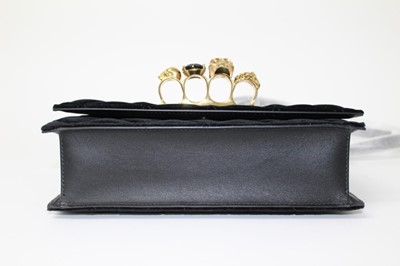 Lot 2130 - Designer Alexander McQueen Knuckle Duster Handbag in quilted black velvet, skulls and gilt chain.  In original box with soft bag, ribbon ties and care leaflets. Unused.