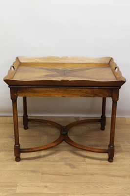 Lot 1318 - Mahogany butler's tray on stand, the quarter-veneered tray with pierced handles to the splayed gallery, on stand