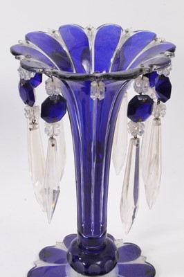 Lot 190 - Pair of Bohemian blue flash cut glass lustres with prismatic drops, 26.5cm high