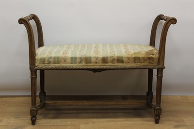 Lot 852 - 19th century Continental beech window seat, with carved scroll ends and stuffover seat on fluted legs and H-shaped stretcher