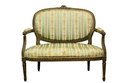 Lot 1333 - Louis XVI style carved beech two seater settee, with oval pad back and seat and well carved ribbon and acanthus frame on fluted legs, 101cm wide