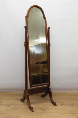 Lot 1340 - Early 20th century mahogany cheval mirror, with arched swing plate on splayed supports, 154cm high