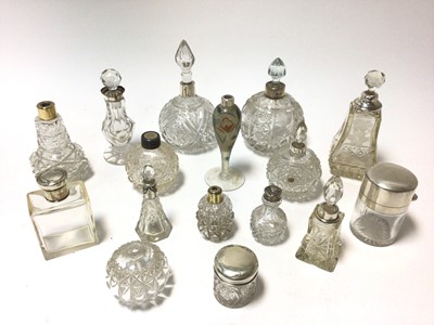 Lot 368 - Collection of late 19th/early 20th century cut glass toilet bottles with silver mounts