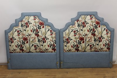 Lot 1342 - Pair of upholstered bed heads of stepped arched form, together with matching curtains