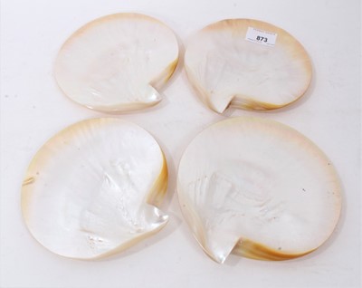 Lot 873 - Set of four polished mother of pearl shell caviar dishes, 14cm long (4)