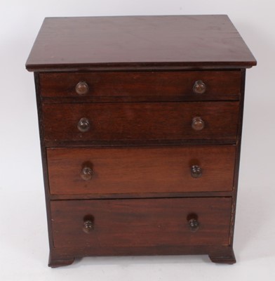 Lot 938 - Mahogany collectors miniature chest of four graduated draws with turned bun handles