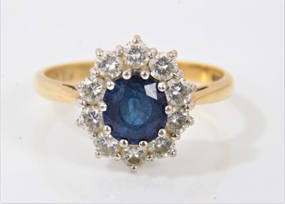 Lot 619 - Sapphire and diamond cluster ring