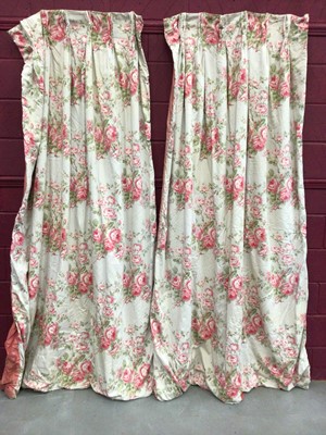 Lot 1503 - Pair of pink rose and green leaf interlined curtains with pinch pleated tops measuring approximately 85cm x 233cm drop