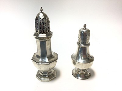 Lot 374 - two silver sugar caster of baluster form with pierced slip in covers