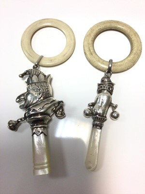 Lot 375 - Two 1930s silver child's rattles in the form of Mr Punch and Toby