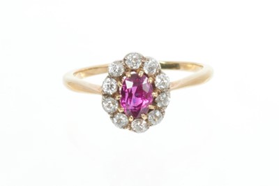 Lot 592 - Ruby and diamond cluster ring