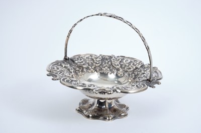 Lot 380 - Victorian silver cake basket of circular form with embossed floral decoration, scroll border