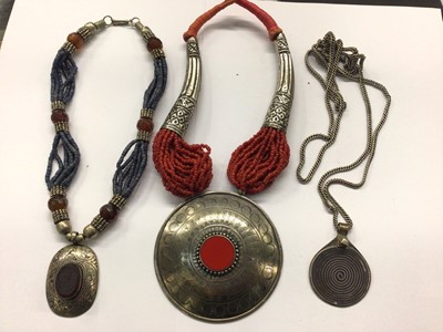 Lot 709 - Ethnic jewellery including multi strand lapis lazuli necklace, long guard chain with niello pendant and multi strand red bead necklace