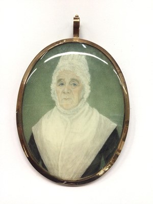 Lot 662 - Georgian oval miniature of an elderly lady, with woven hair panel to reverse