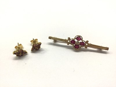 Lot 719 - Gold bar brooch set with pink stones and a central diamond, together with pair gem set stud earrings