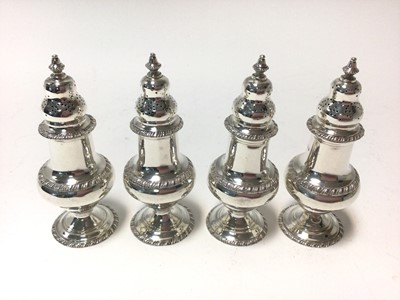 Lot 301 - Set of four 1930s silver casters of baluster form
