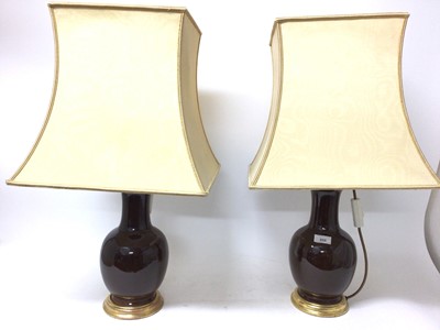 Lot 850 - Pair of Chinese style sang de boeuf vase lamps, with square shades, total height 68cm