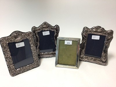 Lot 412 - Edwardian silver photograph frame of rectangular form, (Birmingham 1903) measuring 16.5 x 12.5cm overall, together with Contemporary Victorian style silver photograph frame (London 1989)