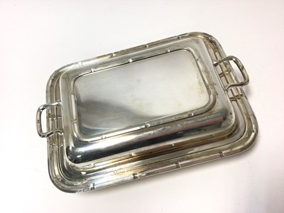 Lot 307 - 1930s silver entree dish with a crenellated border and separate cover with twin handles