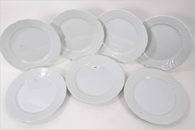 Lot 267 - Twenty-eight Royal Copenhagen blanc de chine dinner plates, with spiral fluting and moulded basket weave borders, 25cm diameter