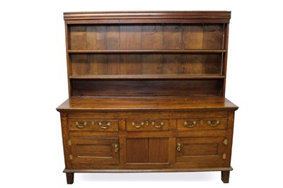 Lot 1381 - Large 18th century and later oak high dresser, with boarded rack and three drawers over twin panelled cupboard doors to the base, raised on stiles, 189cm wide x 57cm deep x 191cm high