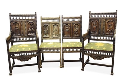 Lot 1442 - Set of four early 20th century Dutch or Belgian carved oak chairs, each with ornately carved and bobbin galleried square back and embroidered seat on conforming understructure, to include pair of c...