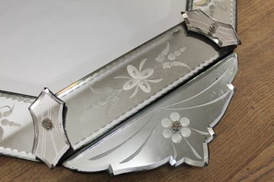 Lot 1445 - 19th century style Venetian etched glass wall mirror, with canted rectangular bevelled plate in etched peripheral plates with shaped cresting, 91 x 51cm
