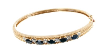 Lot 608 - 9ct gold sapphire and diamond hinged bangle