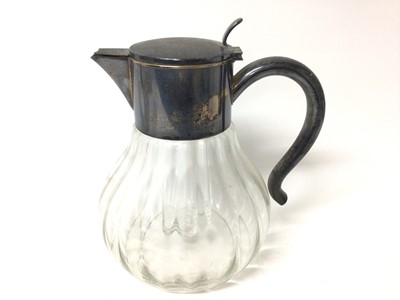 Lot 399 - Large silver plated lemonade jug with ice tube, the glass body of fluted form, 27cm high