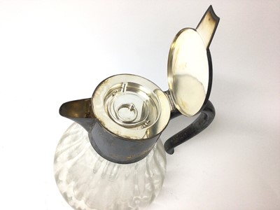 Lot 399 - Large silver plated lemonade jug with ice tube, the glass body of fluted form, 27cm high