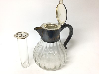 Lot 399 - Large silver plated lemonade jug with ice tube, the glass body of fluted form, 27cm high