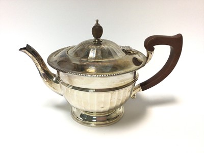 Lot 314 - 1930s silver tea pot of half faceted form, with flared border and hinged domed cover