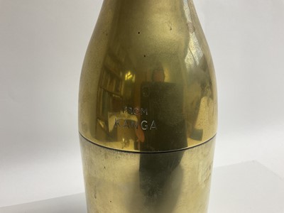 Lot 87 - Dale,Baroness Tyron 'Kanga', Australian socialite and friend of The Prince of Wales, silver plated (worn) Champagne bottle flask engraved ' From Kanga Alexander 1994' . A gift from the Baroness to...
