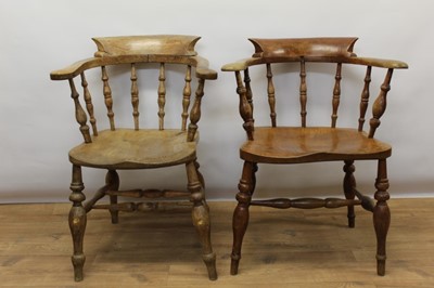 Lot 1470 - Two similar elm captain's chairs