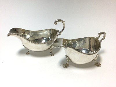 Lot 317 - Contemporary silver sauce boat of conventional form with gadrooned border and one other