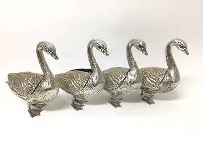 Lot 402 - Novelty set of four silver plated centrepieces in the form of ducks, the wings on hinges to reveal flower troughs, with inset glass eyes, 25cm high