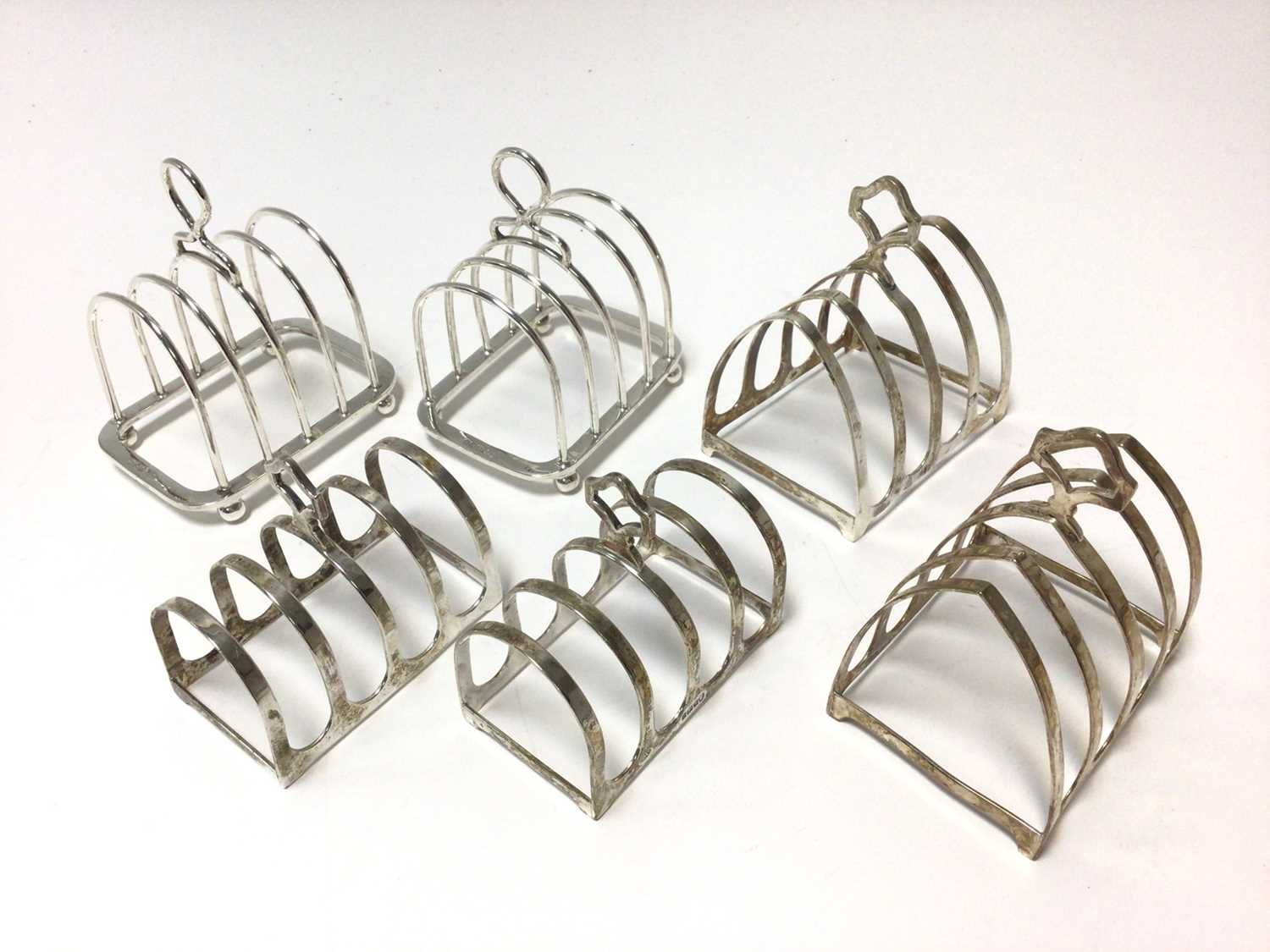 Lot 319 - Three pairs of silver toast racks (Various
