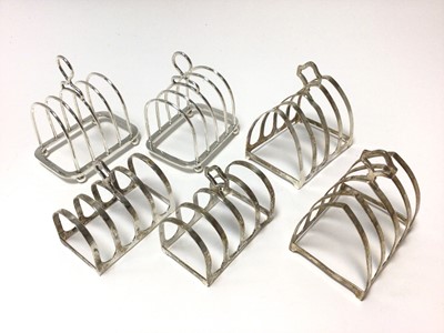 Lot 319 - Three pairs of silver toast racks (Various dates and makers). All at approximately 12ozs. L