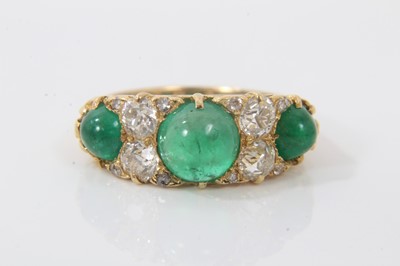 Lot 613 - Victorian style emerald and diamond ring with three cabochon emeralds and four old cut diamonds with rose cut diamond accents to the claws in carved gold setting on 18ct yellow gold shank. Estimate...