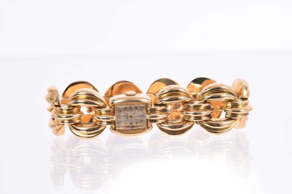 Lot 634 - Art Deco ladies Omega 18ct gold bracelet watch with Omega 15 jewel movement numbered 10483201, the rectangular dial with gold dot and dart hour markers, in gold case on gold bracelet, approximately...